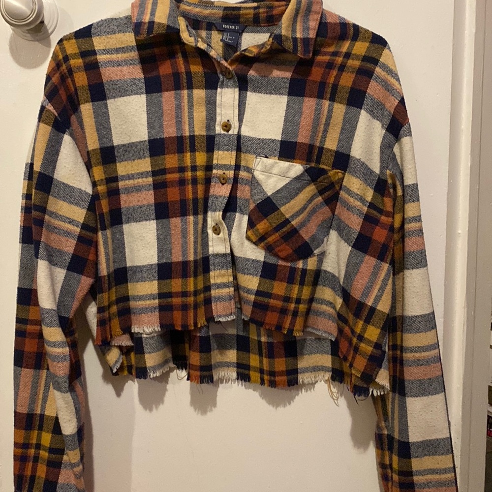 A cropped distressed sweater.